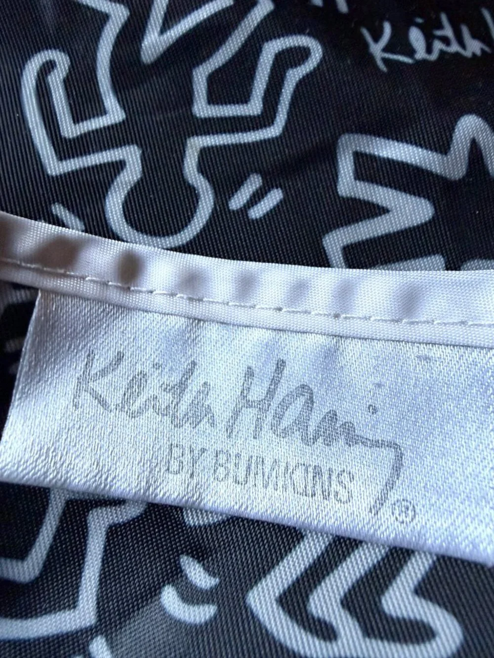 Keith Haring x Bumkins baby bib pop art black white red